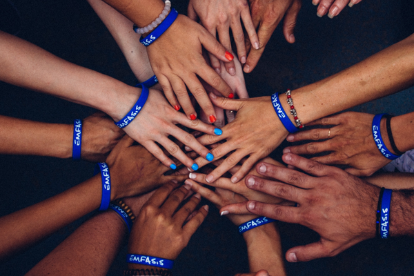 Group of hands in middle connected